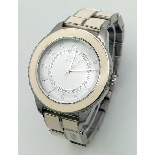 952 - A Storm Zarina Ceramic and Steel Ladies Watch. Case - 38mm. White dial with white stone decoration. ... 