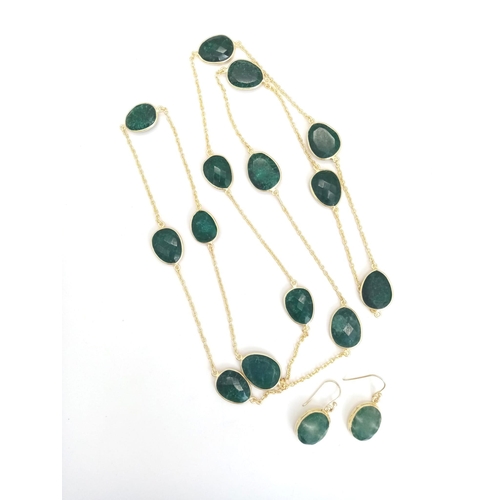 1117 - A Pair of Emerald Earrings and Matching Necklace on Gilded Metal. Necklace - 100cm.