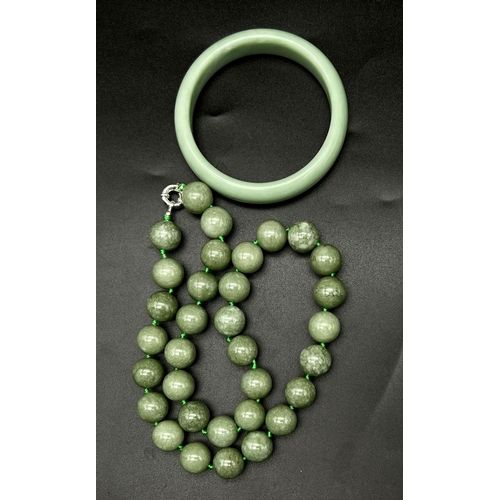 1263 - A Pale Green Jade Bangle and Necklace Bead Set. Beads -14mm. 6cm inner diameter bangle. Necklace len... 