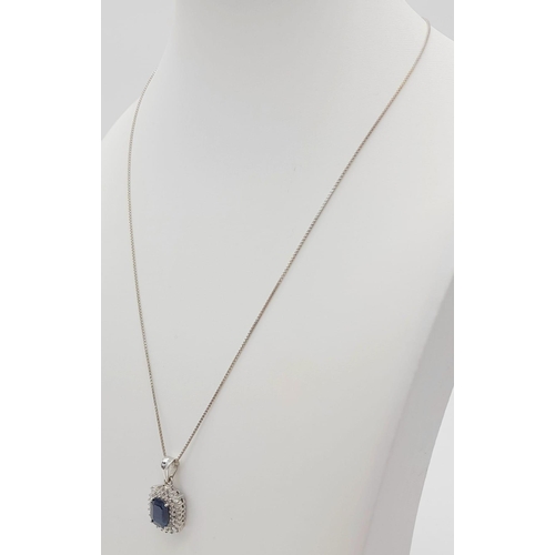 135 - An 18K White Gold, Sapphire and Diamond Pendant on an 18K White Gold Necklace. Rectangular 2ct sapph... 