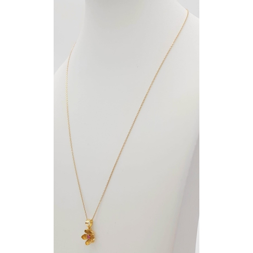 150 - An 18K Yellow Gold Ruby Floral Pendant on an 18K Yellow Gold Necklace. 2cm and 46cm. 2.65g total wei... 