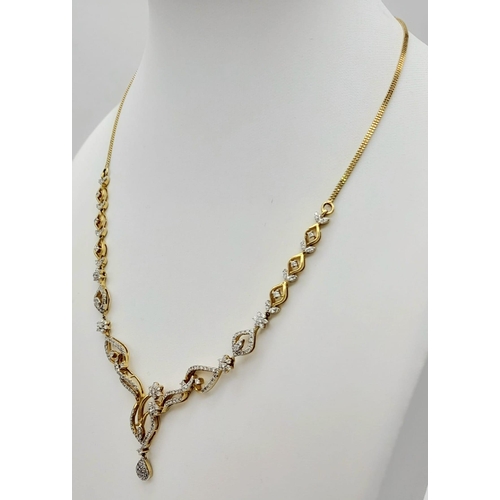 83 - A very elegant 14 K yellow gold necklace with a beautiful design with diamonds (1.40 carats), length... 