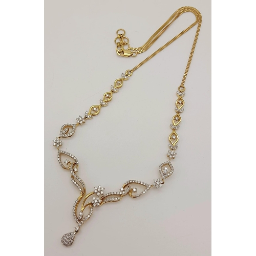 83 - A very elegant 14 K yellow gold necklace with a beautiful design with diamonds (1.40 carats), length... 