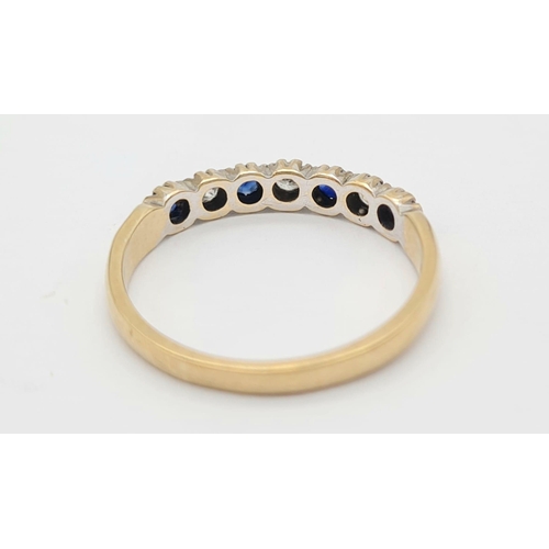 513 - A 9k Yellow Gold Sapphire and White Stone Ring. Size O. 2g total weight.