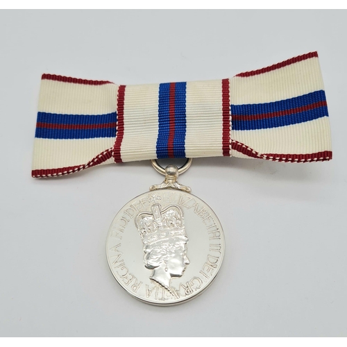 71 - A Queen Elizabeth the Second’s Silver Jubilee Medal 1977, mounted on a ribbon bow for wear by a lady... 