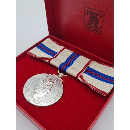 71 - A Queen Elizabeth the Second’s Silver Jubilee Medal 1977, mounted on a ribbon bow for wear by a lady... 