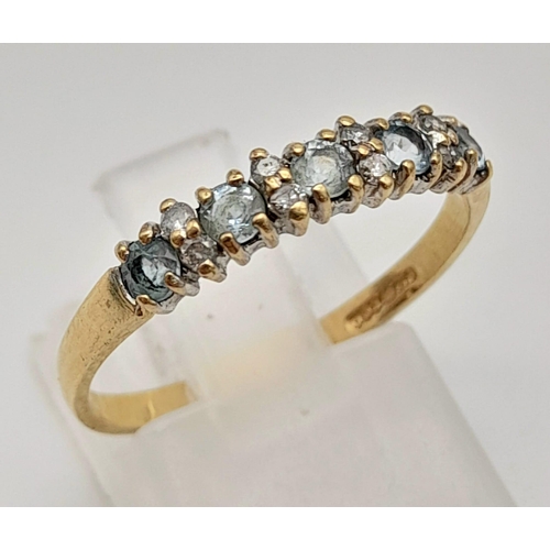 1001 - 9K YELLOW GOLD DIAMOND & TOPAZ BAND RING. TOTAL WEIGHT 1.4G SIZE P