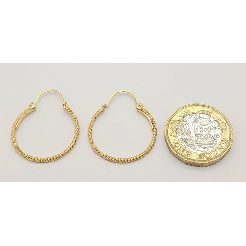 1006 - 9k yellow gold twisted hoop earrings 2.2g