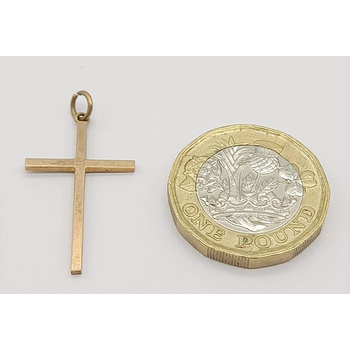 1069 - A 9K Yellow Gold Cross Pendant. 30mm x 15mm. 0.92g