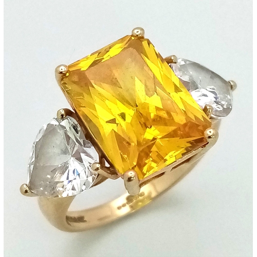 184 - A 14K Yellow Gold Citrine and Moissanite Ring. Large central bright citrine (6ct) with a heart-shape... 