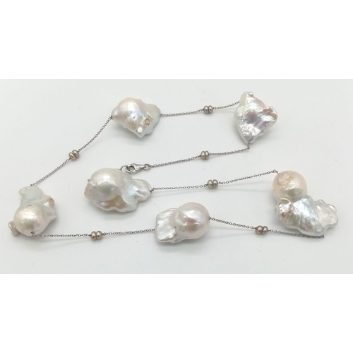 276 - A 14K White Gold Baroque Pearl Necklace. Six irregular shaped South Sea baroque pearls. 44cm. 37g to... 