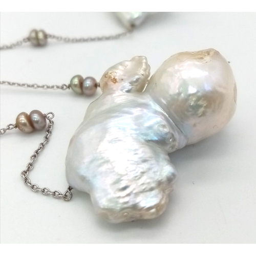 276 - A 14K White Gold Baroque Pearl Necklace. Six irregular shaped South Sea baroque pearls. 44cm. 37g to... 