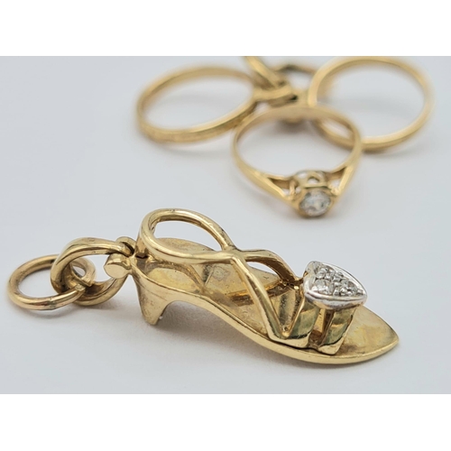 472 - 9k yellow gold cubic zirconia set heeled shoe (1.8g) & 3 rings-1 with cubic zirconia (1.4g) charms t... 