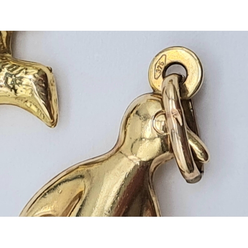 486 - 9k yellow gold penguin (1.2g) dolphin (0.8g) & bear (0.9g) charms total weight 2.9g