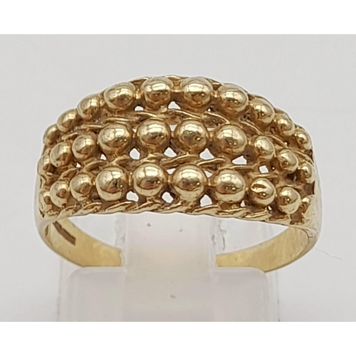 498 - A Vintage 9K Yellow Gold Keeper Ring. Size P. 3g.