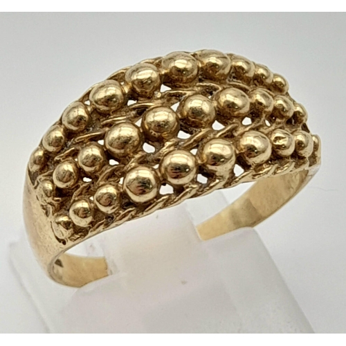 498 - A Vintage 9K Yellow Gold Keeper Ring. Size P. 3g.