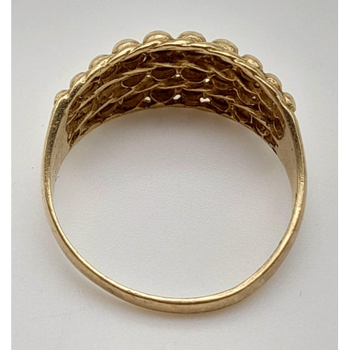 498 - A Vintage 9K Yellow Gold Keeper Ring. Size P. 3g.