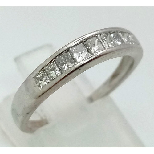 501 - An 18K White Gold Princess Cut Half-Eternity Diamond Ring. 0.60ct approx. Size N. 2.51g total weight... 