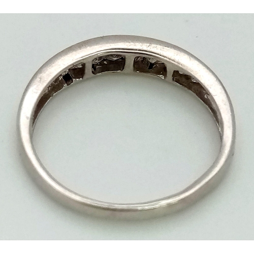 501 - An 18K White Gold Princess Cut Half-Eternity Diamond Ring. 0.60ct approx. Size N. 2.51g total weight... 