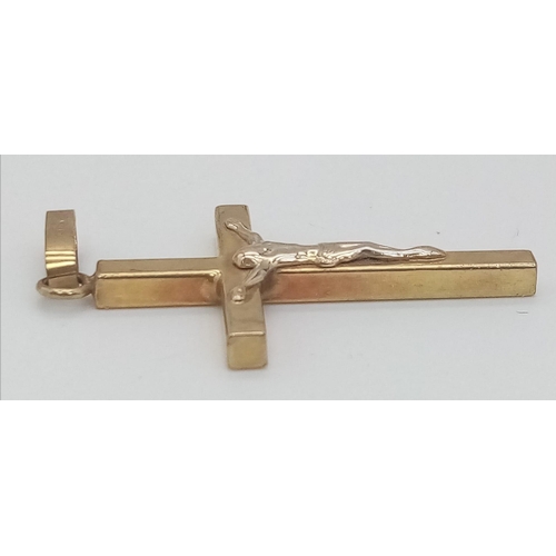 507 - A 9K Yellow and White Gold Vintage Crucifix. 5cm x 2cm. 1.82g