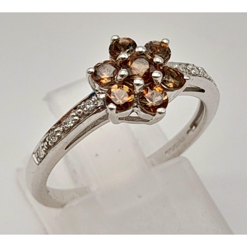 558 - 9K WHITE GOLD DIAMOND 7 BROWN STONE CLUSTER RING. TOTAL WEIGHT 2.5G SIZE N