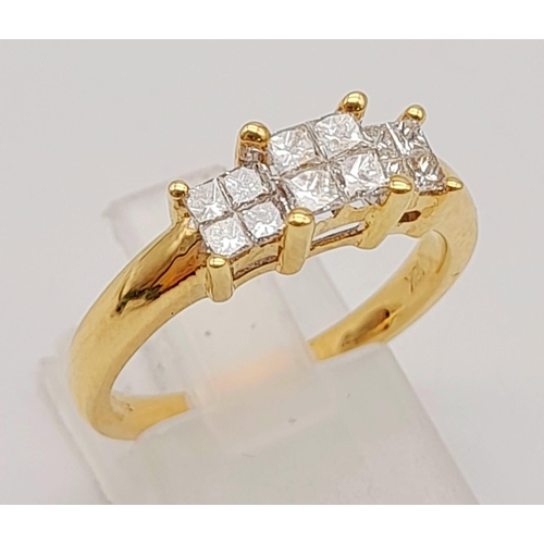 995 - An 18K Yellow Gold Diamond Ring. Princess cut diamonds - approx 1ct. Size O. 4.94g total weight.