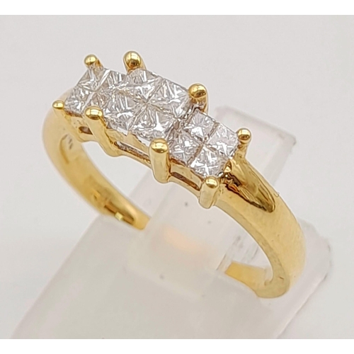 995 - An 18K Yellow Gold Diamond Ring. Princess cut diamonds - approx 1ct. Size O. 4.94g total weight.