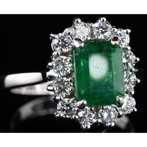 232 - 18k white gold Emerald and Diamond ring, 1.95ct green emerald centre stone, and 0.71ct diamonds surr... 