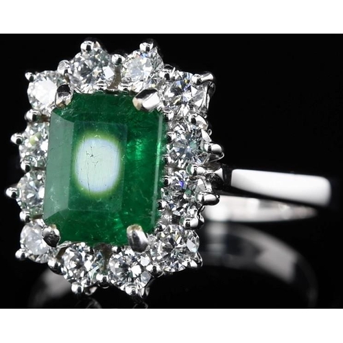 232 - 18k white gold Emerald and Diamond ring, 1.95ct green emerald centre stone, and 0.71ct diamonds surr... 