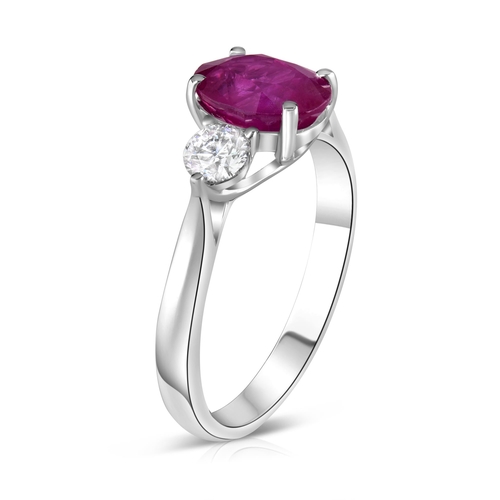 387 - 18k white gold Ruby and Diamond 3 stone ring, 1.85ct oval cut ruby centre, and 0.38ct diamonds to th... 