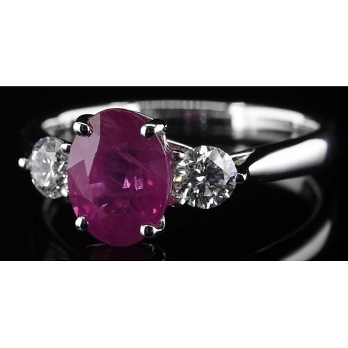 387 - 18k white gold Ruby and Diamond 3 stone ring, 1.85ct oval cut ruby centre, and 0.38ct diamonds to th... 