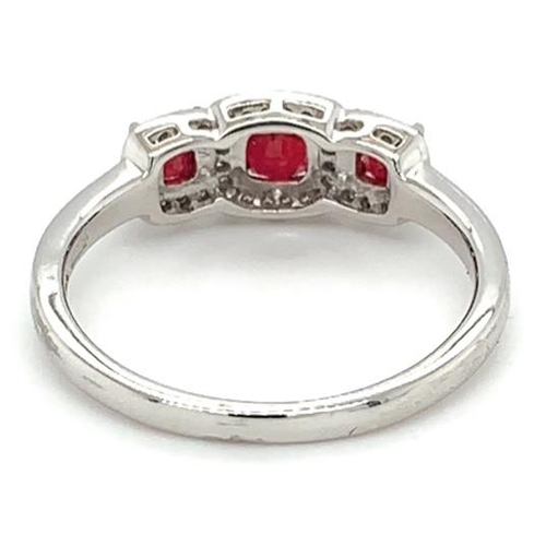 473 - 18k white gold Ruby and Diamond ring, 0.72ct of 3 stones set ruby and 0.11ct diamonds halo setting, ... 