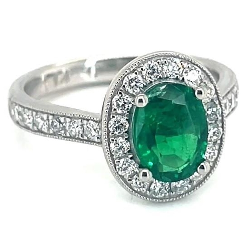 653 - Platinum Emerald and Diamond ring, 1.14ct oval green emerald centre stone, 0.47ct diamonds surroundi... 