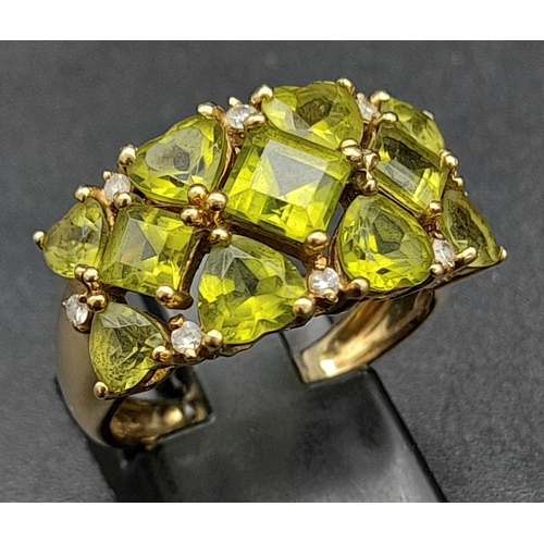 127 - A 9K Yellow Gold Peridot Gemstone Ring. Size P. Beautiful pieces of lime-green peridot. Size P. 4.48... 