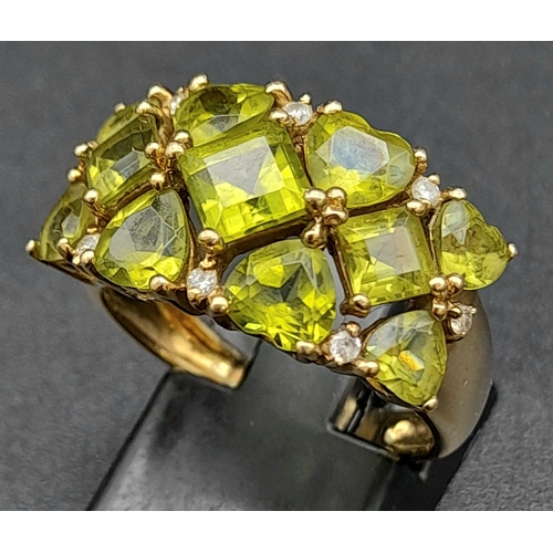 127 - A 9K Yellow Gold Peridot Gemstone Ring. Size P. Beautiful pieces of lime-green peridot. Size P. 4.48... 