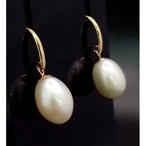 255 - A Pair of 9K Gold Cultured Pearl Earrings. 12mm drop pearls.