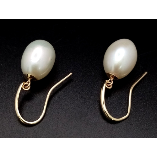 255 - A Pair of 9K Gold Cultured Pearl Earrings. 12mm drop pearls.