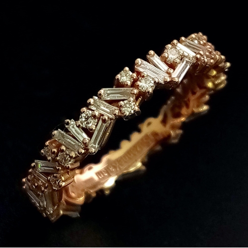 1173 - A Susan Kalan (designer) 18K Gold and Diamond Full Eternity Ring. A combination of baguette and roun... 