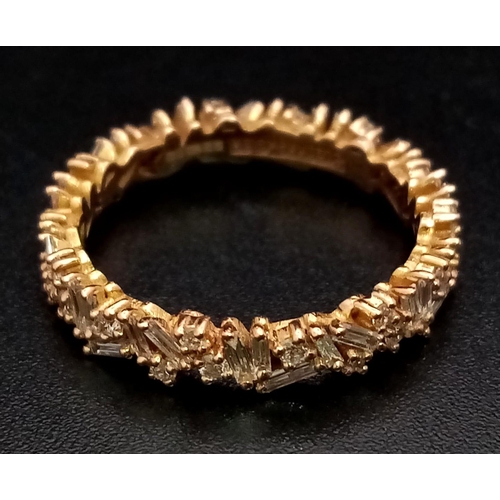 1173 - A Susan Kalan (designer) 18K Gold and Diamond Full Eternity Ring. A combination of baguette and roun... 