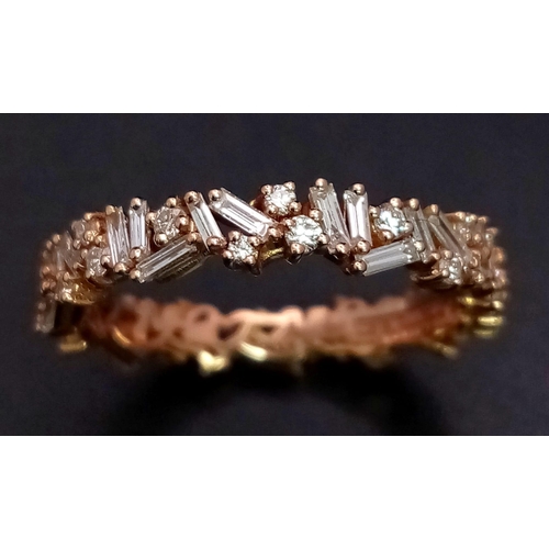 1173 - A Susan Kalan (designer) 18K Gold and Diamond Full Eternity Ring. A combination of baguette and roun... 