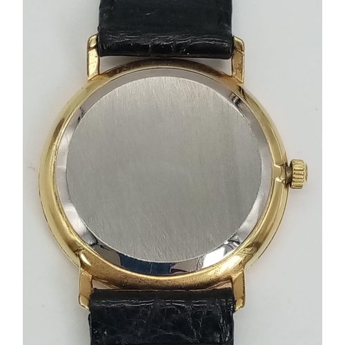 141 - A Vintage Zenith Mechanical Gents Watch. Black leather strap. Two-tone case - 33mm. White porcelain ... 