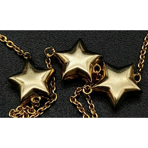 816 - 9k yellow gold 20cm long triple star bracelet set with cubic zirconia. Total Weight 1.4g