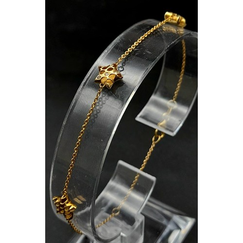 816 - 9k yellow gold 20cm long triple star bracelet set with cubic zirconia. Total Weight 1.4g