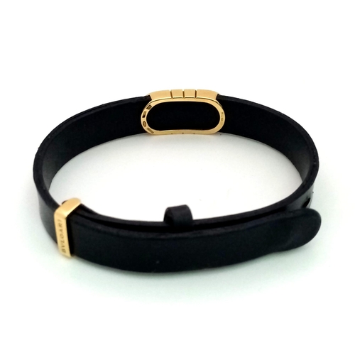 101 - A Bulgari Perentesi 18K Gold and Black Leather Bracelet. Comes in a Bulgari presentation case (worn ... 