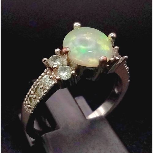 1058 - Silver Tone Metal and Fire Opal Ring with White Stone Shoulders. Total Weight 2.42grams. Size N.