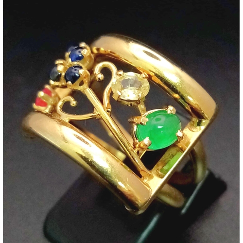 48 - An 18 K yellow gold ring with an artistic design and adorned with an emerald cabochon, plus ruby, di... 