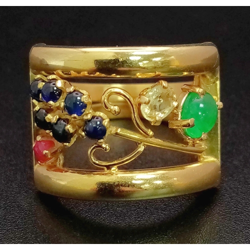 48 - An 18 K yellow gold ring with an artistic design and adorned with an emerald cabochon, plus ruby, di... 