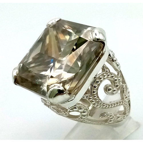 1631 - A Rare 79.4ct Brandy Shade Moissanite Ring set in 925 Silver. Size S. 31g total weight.