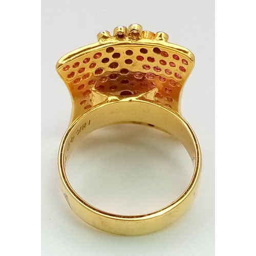 132 - A gorgeous 18 K yellow gold ring with dozens of rubies and diamonds. Ring size: M, weight: 10.1 g. A... 