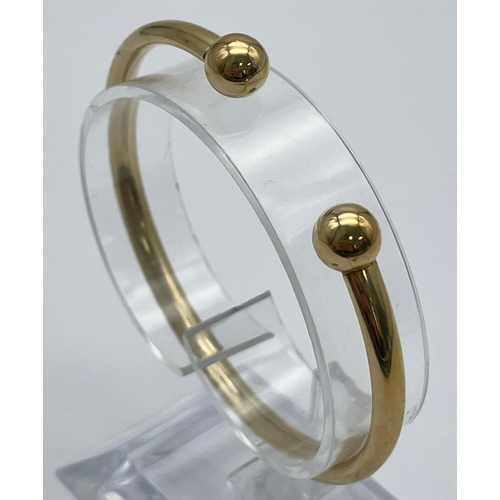 419 - A 9k Yellow Gold All Ended Bangle. 5.7g.